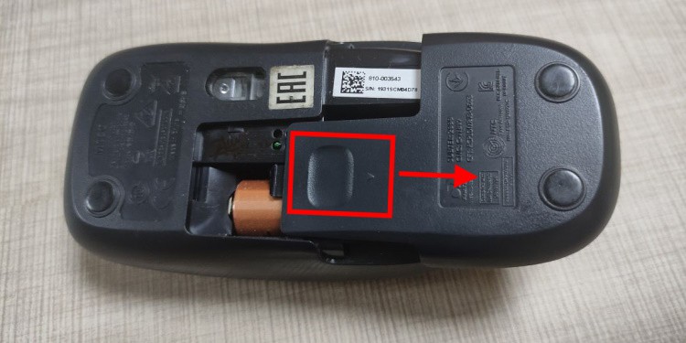 Mouse Clicking on Its Own? Here's How to Fix it 3 MouseBatteryCompartmentSlideOpen