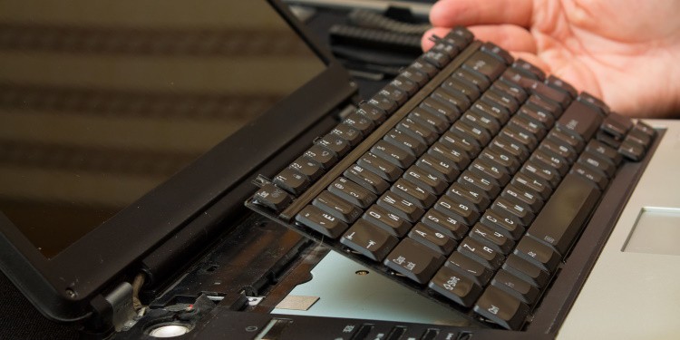 remove the keyboard from the laptop
