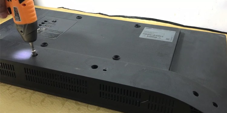 unscrew screws from back panel