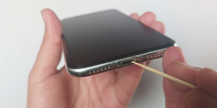 How to Fix a Loose iPhone Charging Port 1 clean the iphone charging port