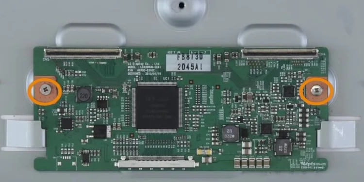 unscrewing-tcon-board-from-chassis-of-tv