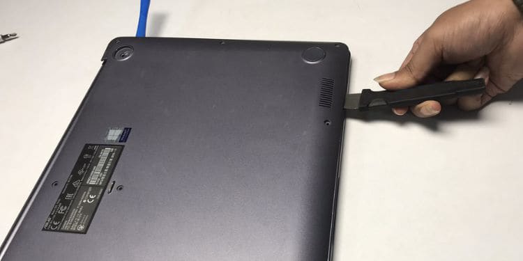 using prying tool to remove the bottom casing