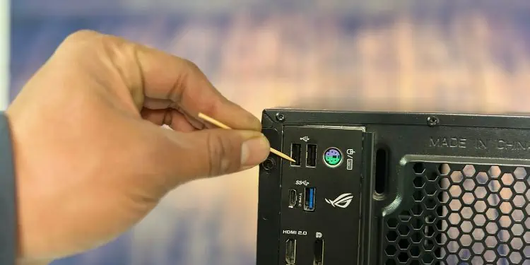 carefully-pull-out-dirt-particles-using-a-toothpick