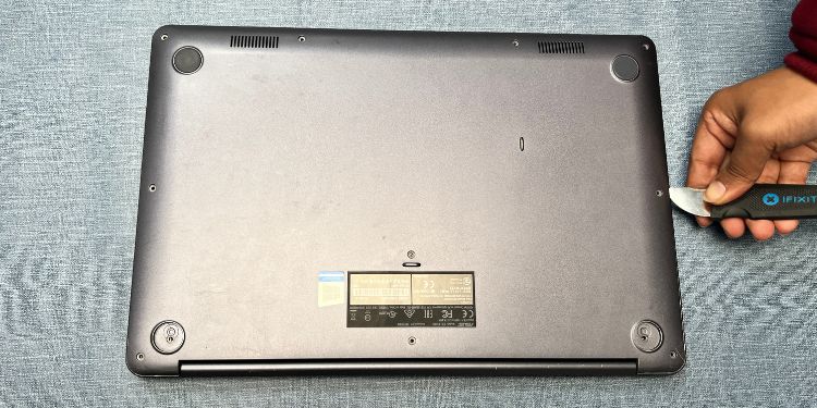 pry out laptop bottom casing