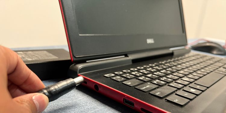 remove ac adapter from dell laptop