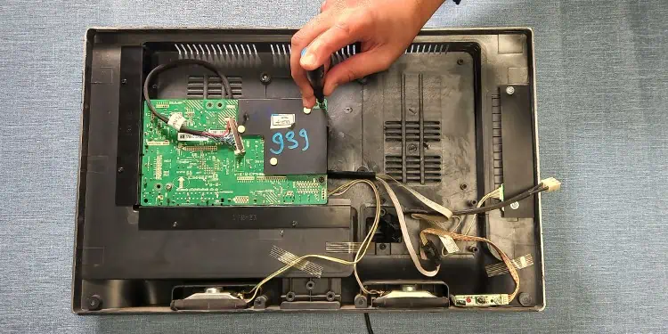 Hisense TV Not Turning On? Here’s How to Fix It 13 unscrew-psu-from-tv