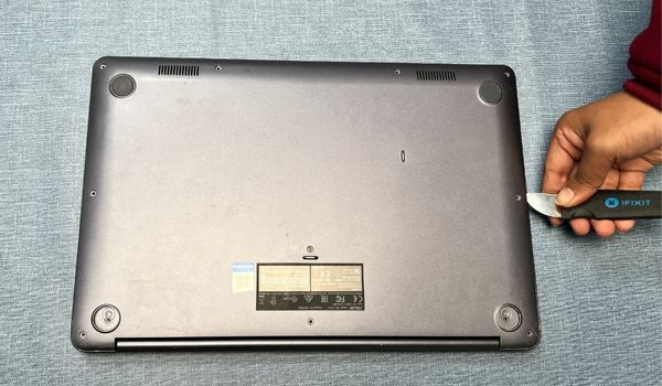 pry out the laptop bottom casing
