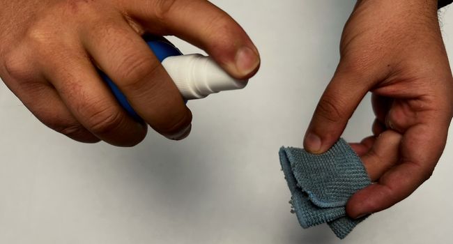 apply lcd screen cleaner to microfiber cloth