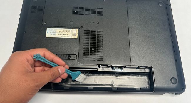 brush cleaning external battery compartment