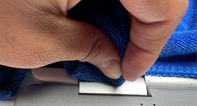 clean laptop hinge surface