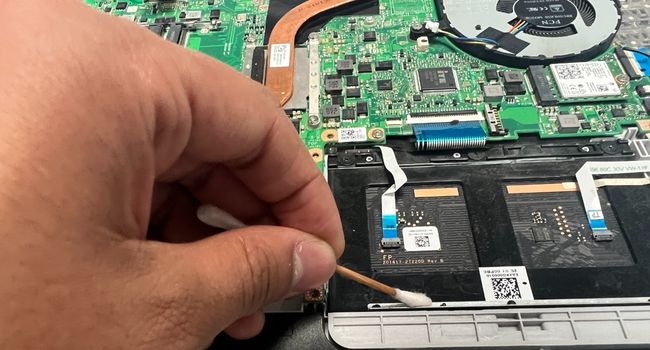 clean laptop internal battery compartment edges