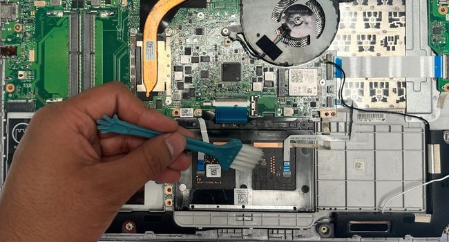 clean laptop internal battery compartment
