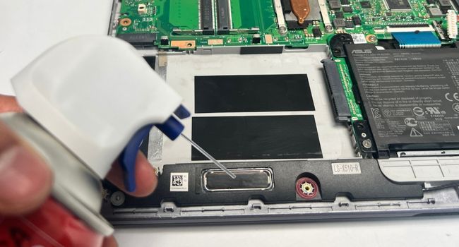 clean laptop speaker with compressed air