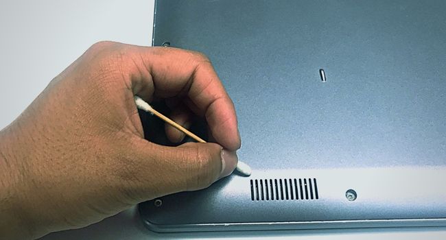 clean laptop vents using qtip