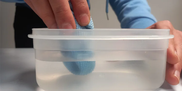 dipping-micro-fiber-cloth-in-distilled-water