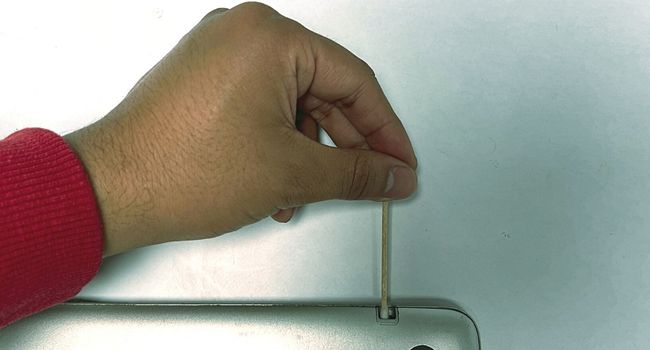insert q tip inside pen slot
