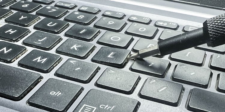insert-screwdriver-laptop-keyboard