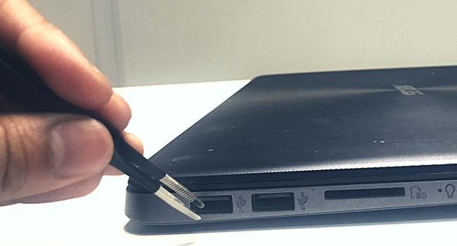 pluck out hair using tweezers laptop port
