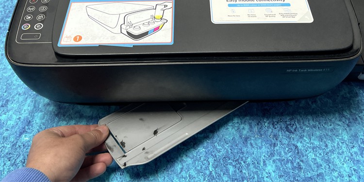 push the output tray inside