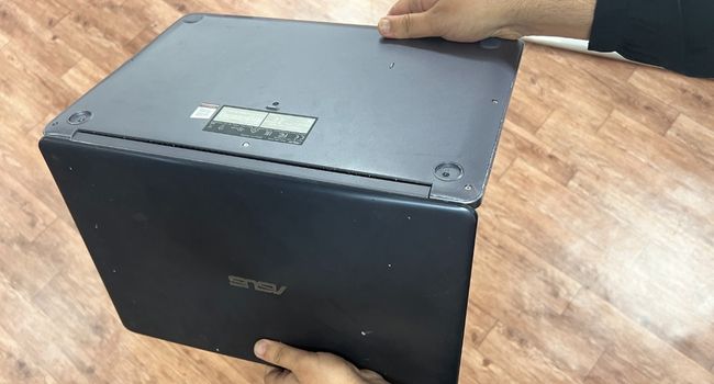 shake laptop to remove debris
