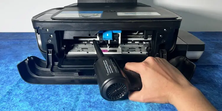 How to Clean a Printer (Complete Guide) 13 blow-the-carriage