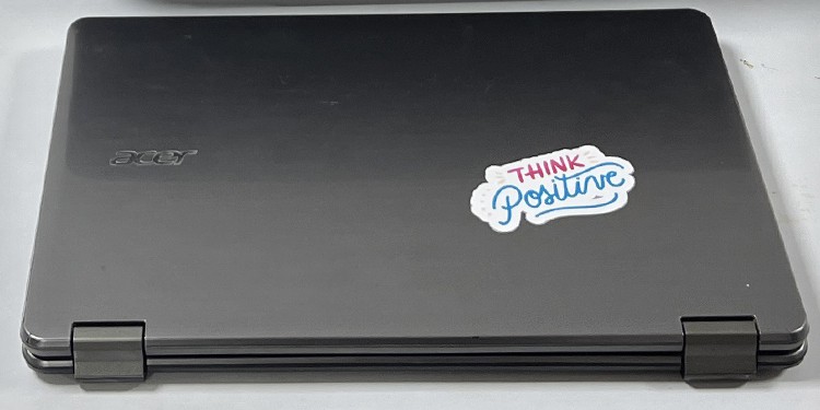 paste-sticker-in-laptop