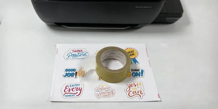 How to Print Stickers at Home (Step-by-Step Guide) 18 put-transparent-tape-in-sticker-paper
