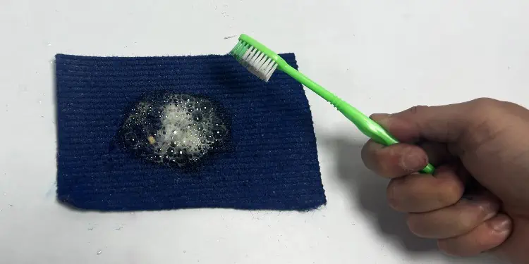 How to Remove Printer Ink Stains From Clothes, Paper, Carpet 13 scrub-the-carpet-with-toothbrush