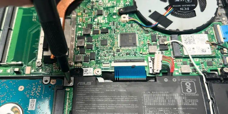 How to Remove a Laptop Battery? Step-by-Step Guide 18 unscrew-the-screws-that-hold-the-integrated-battery-in-place