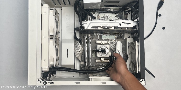 AIO Pump Making Noise? Here’s How You can Fix It 2 lay-pc-case-on-side-and-tap-radiator-pump-and-tubes