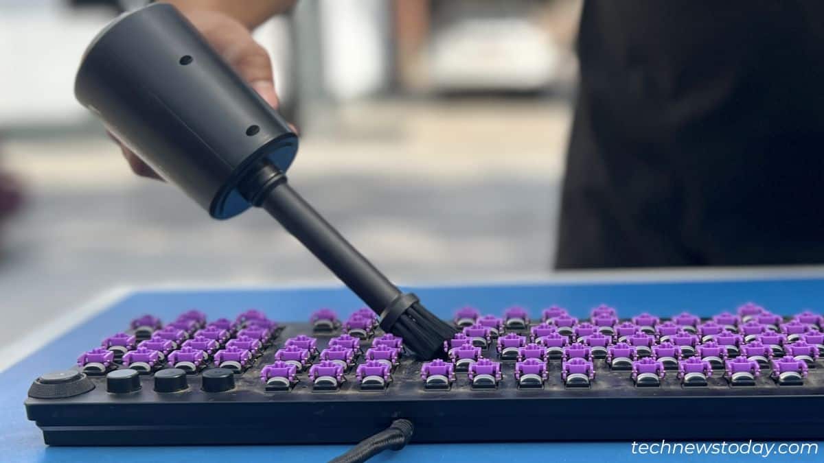 using air duster to dust off particles from razer keyboard