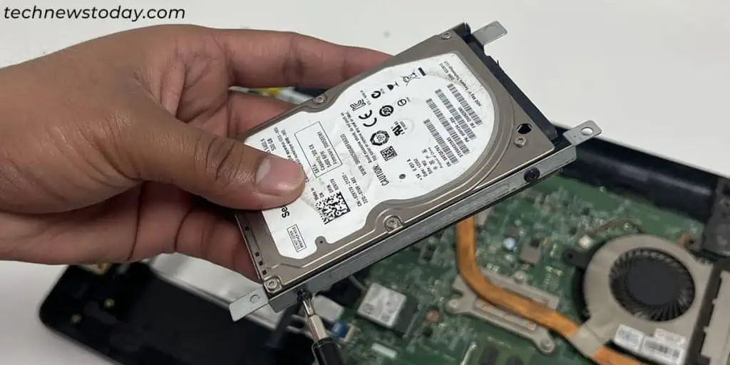 How To Upgrade Your Laptop With an SSD? 10 remove-hard-drive-from-enclosure-or-bracket-1024x512