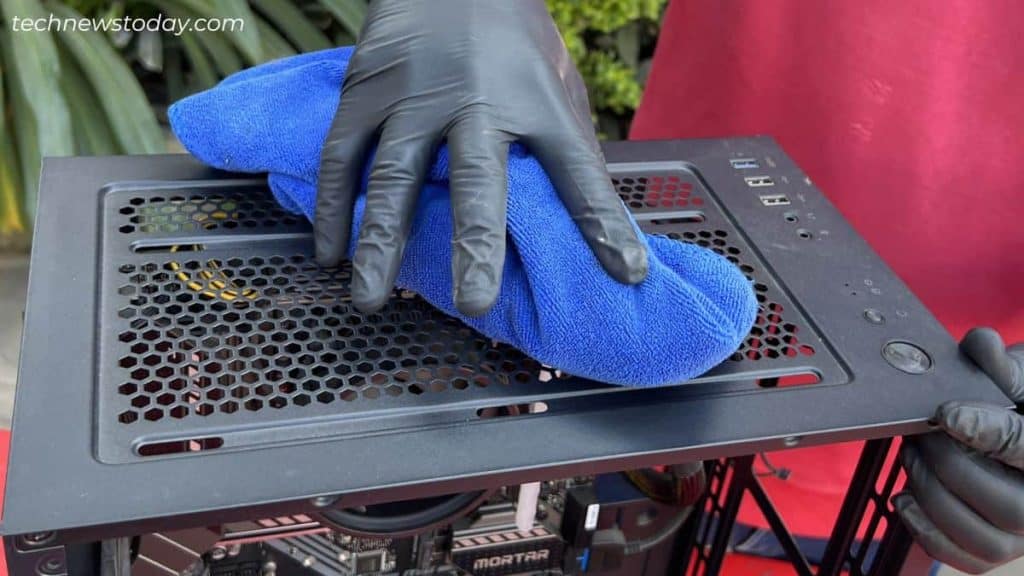 cleaning using microfiber towel top pc case