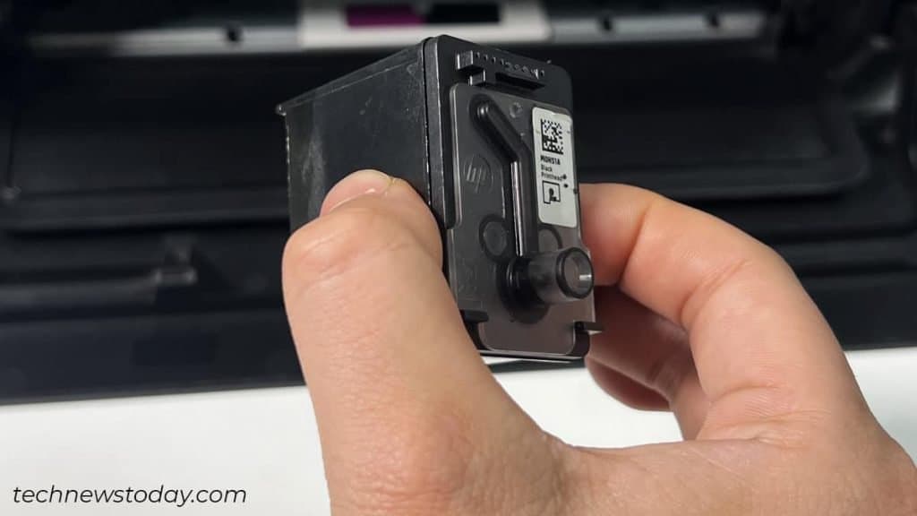 How to Change Ink in HP Printer? Step-by-Step Guide 7 hold-the-ink-cartridge-this-way