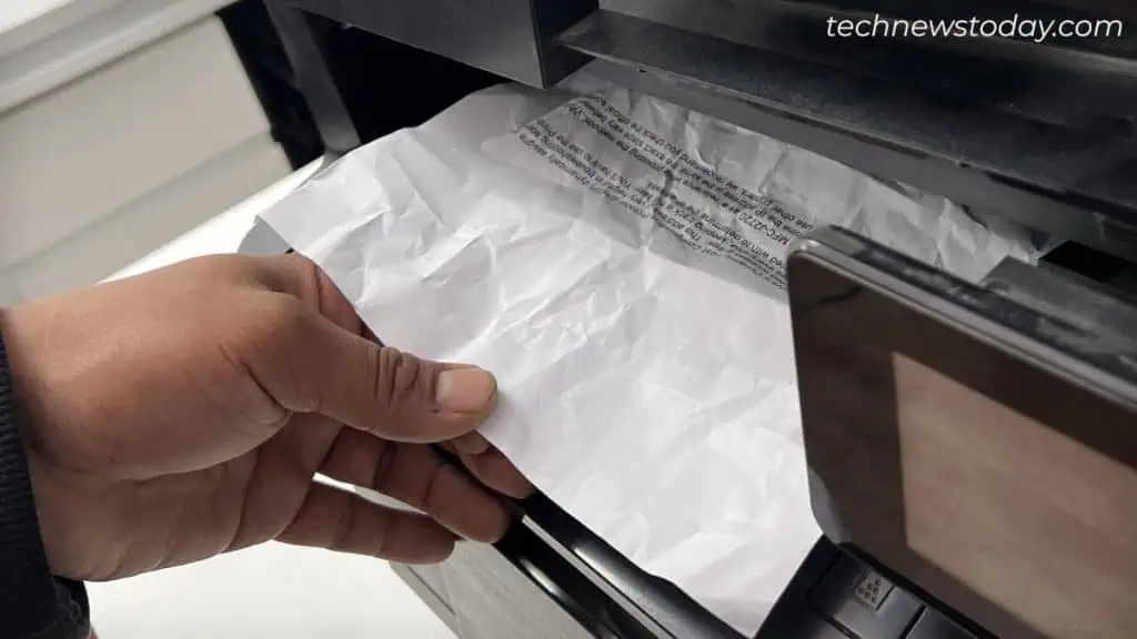 How to Fix Paper Jam on HP Printer 12 pull-out-scrap-papers-from-output-tray-hp-printer-1024x576