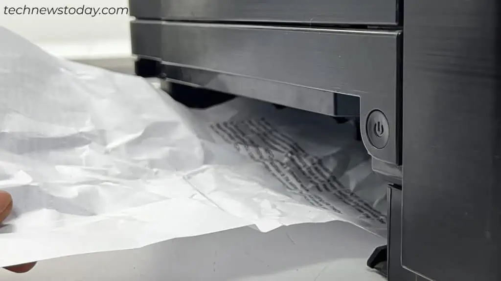 removing-paper-scraps-from-printer-input-tray-1024x576