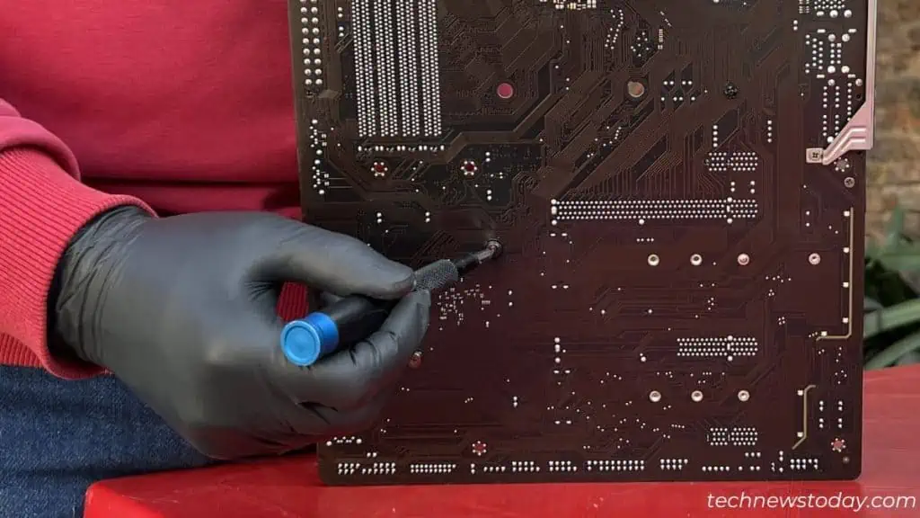 How To Clean A Motherboard 17 unscrew-heatsink-screws-from-the-back-of-the-motherboard-1024x576